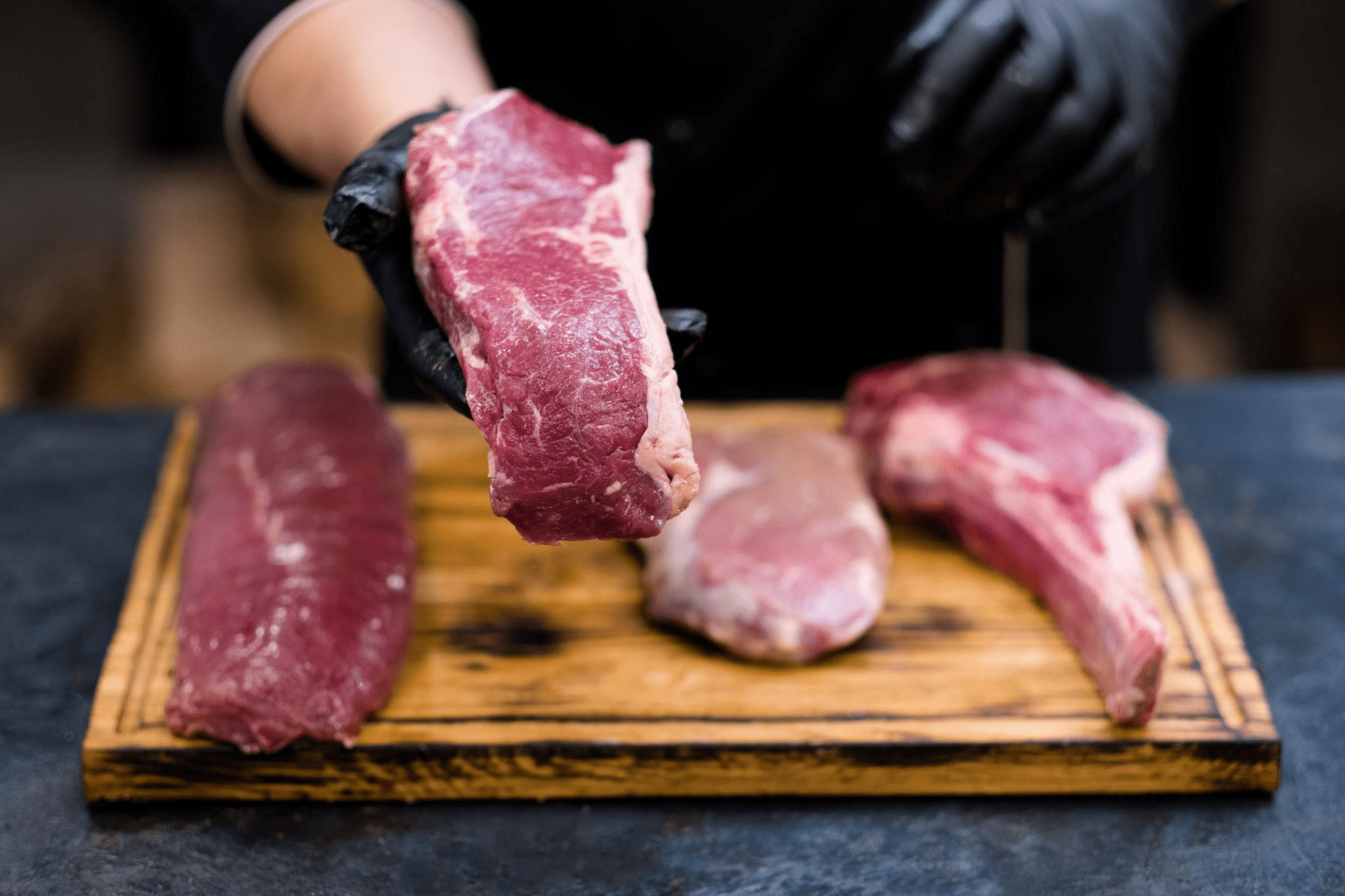 butcher shop fresh cuts raw beef meat chef steaks
